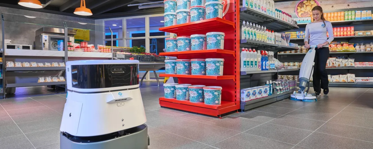 Co-botic 45 intelligent robotic scrubber-dryer cleaning a grocery store