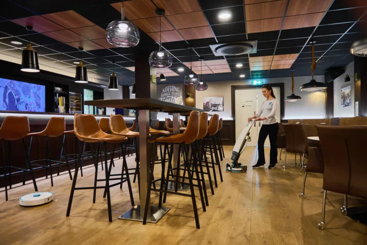 imop Lite Pro cleaning a food and beverage bar